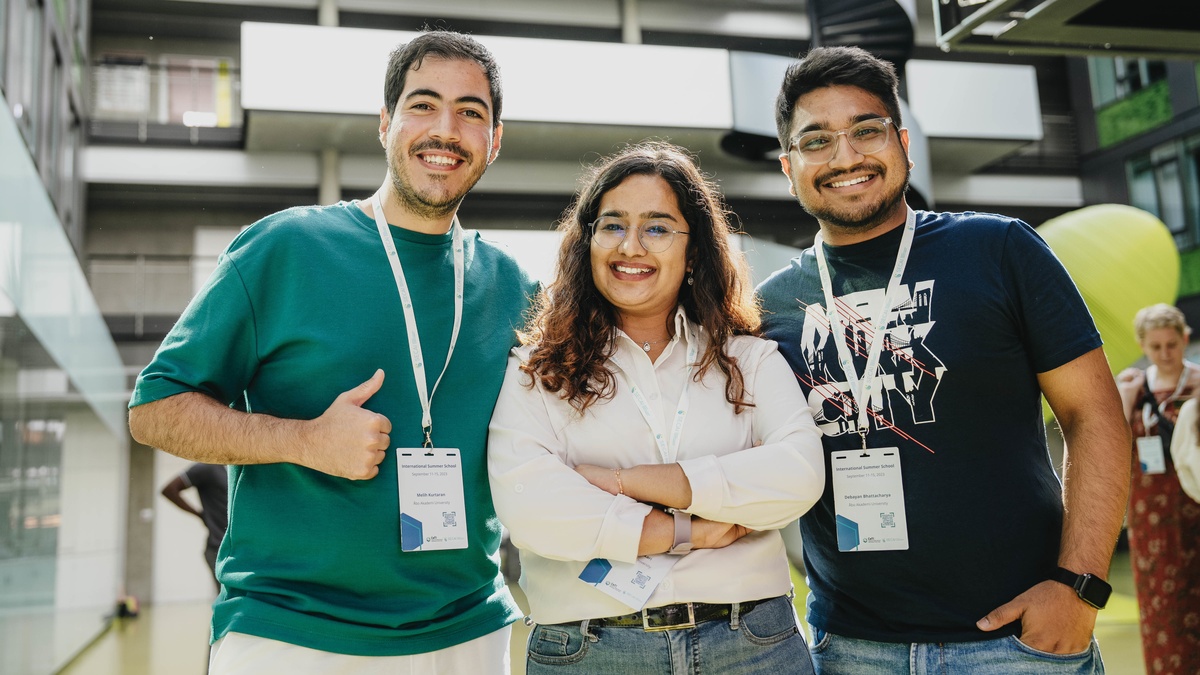Drei Teilnehmer:innen an der SECAI Summer School 2023